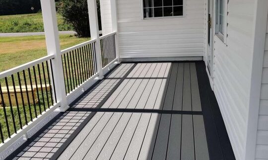 Porch addition with composite flooring